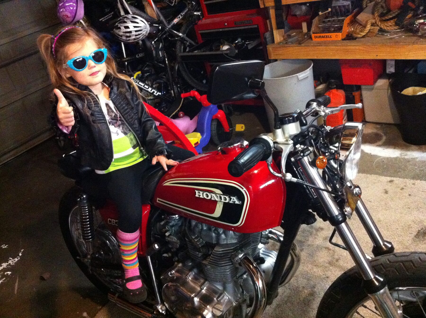 Kid on the red CB360, thumbs up