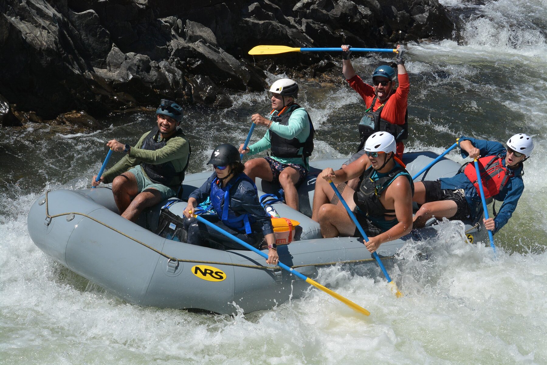 The 14-foot NRS raft running whitewater as a paddle boat with a full crew