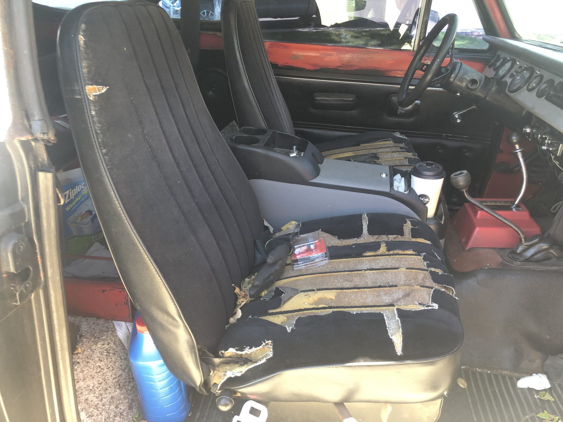 Torn seats before restoration